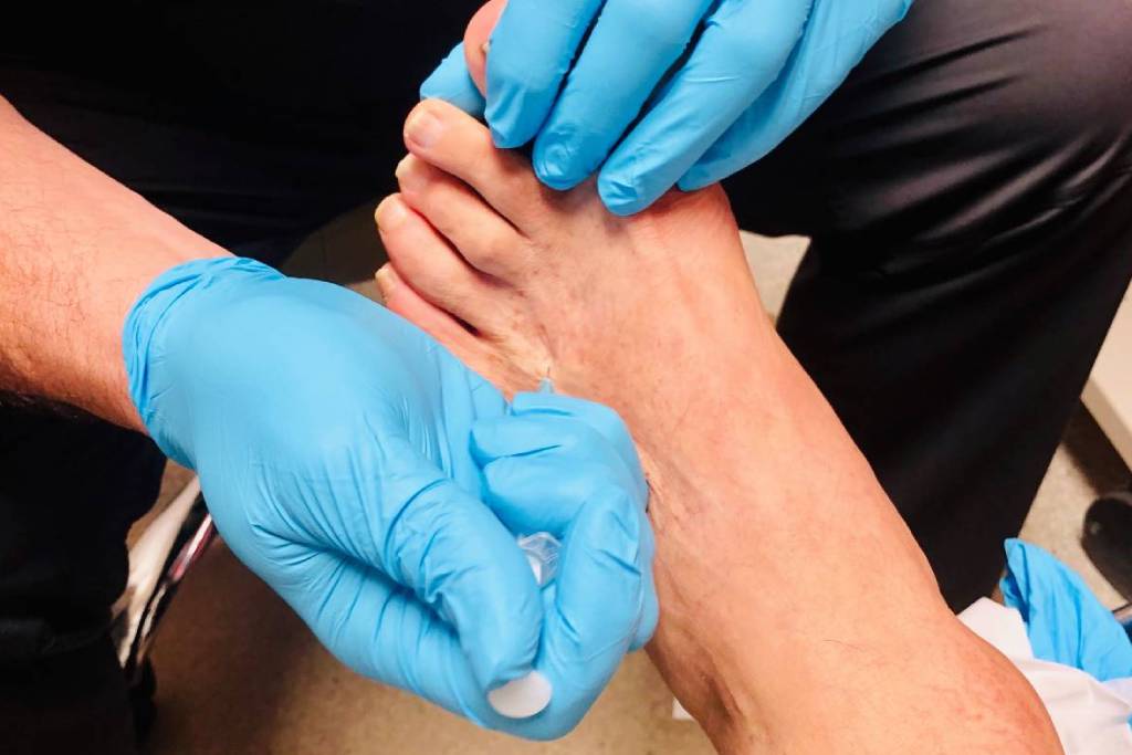 foot-care-professional-treating-patient-in-medical